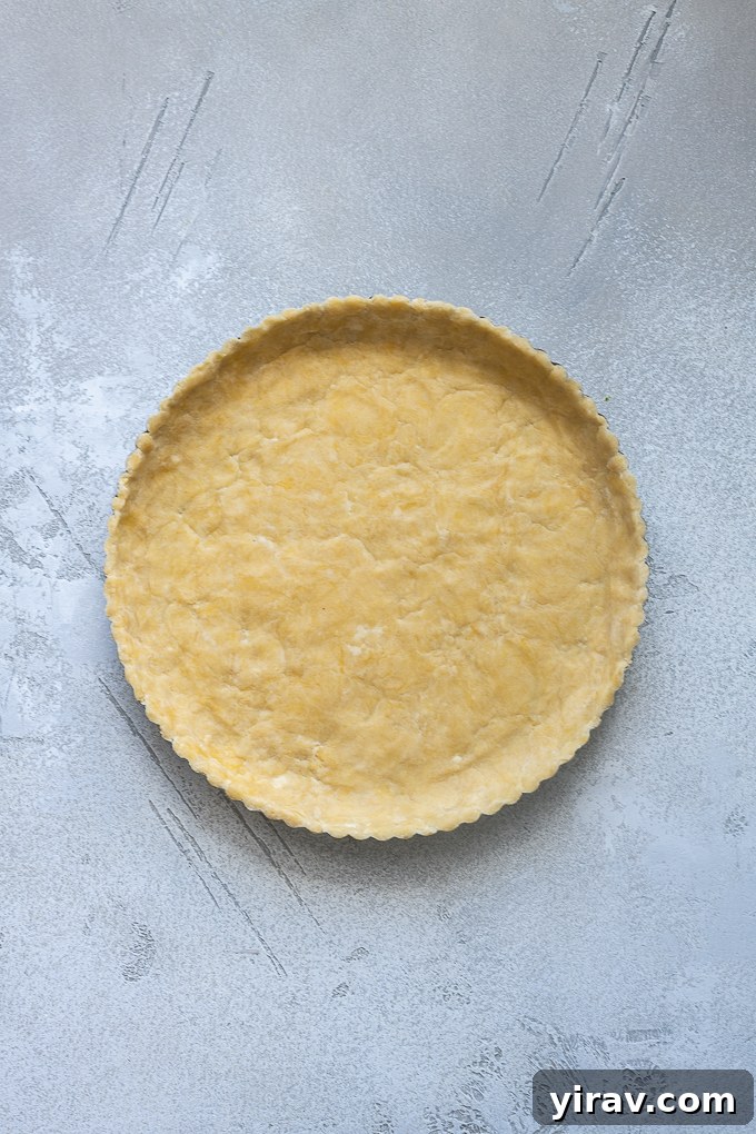 Buttery Sweet Tart Dough 10 Pate sucree dough perfectly pressed into a tart pan, ready for baking.