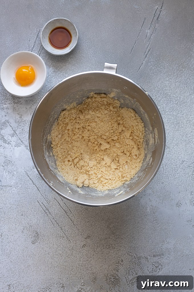Buttery Sweet Tart Dough 5 Creamed butter, powdered sugar, and flour mixture for pate sucree, showing a fluffy texture.