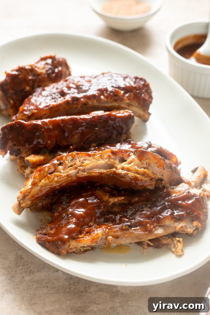 Slow cooker bbq baby back ribs cut on a platter.