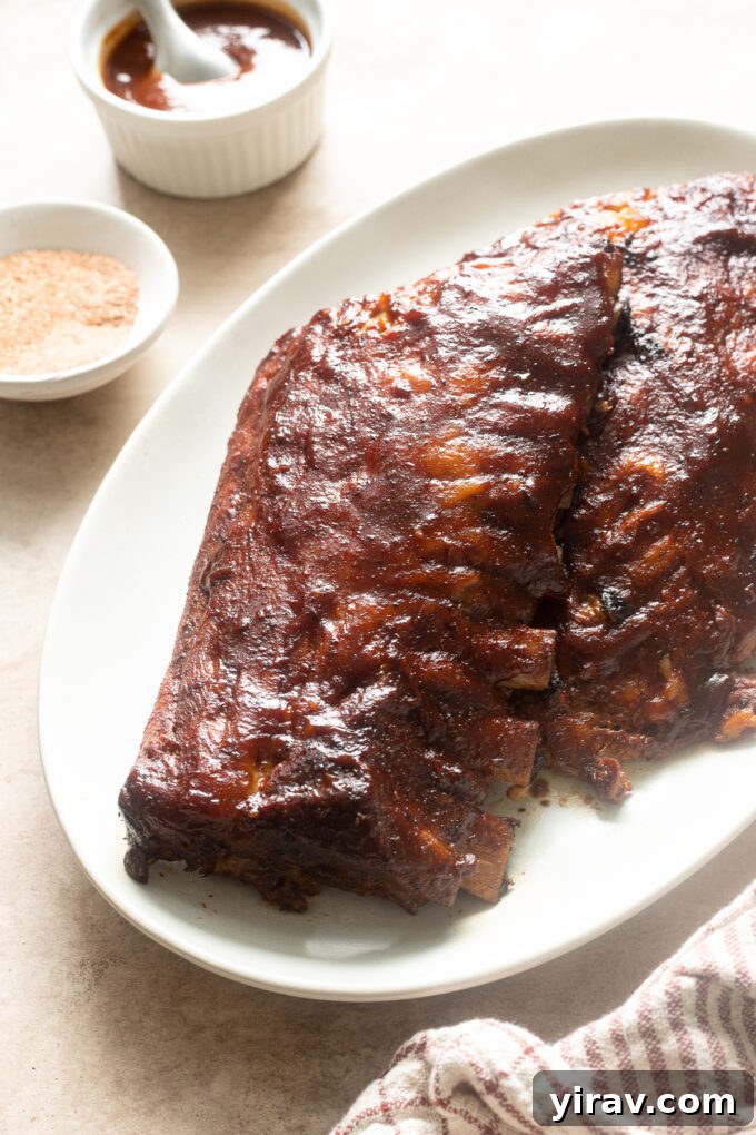 Slow cooker bbq pork ribs on a platter.