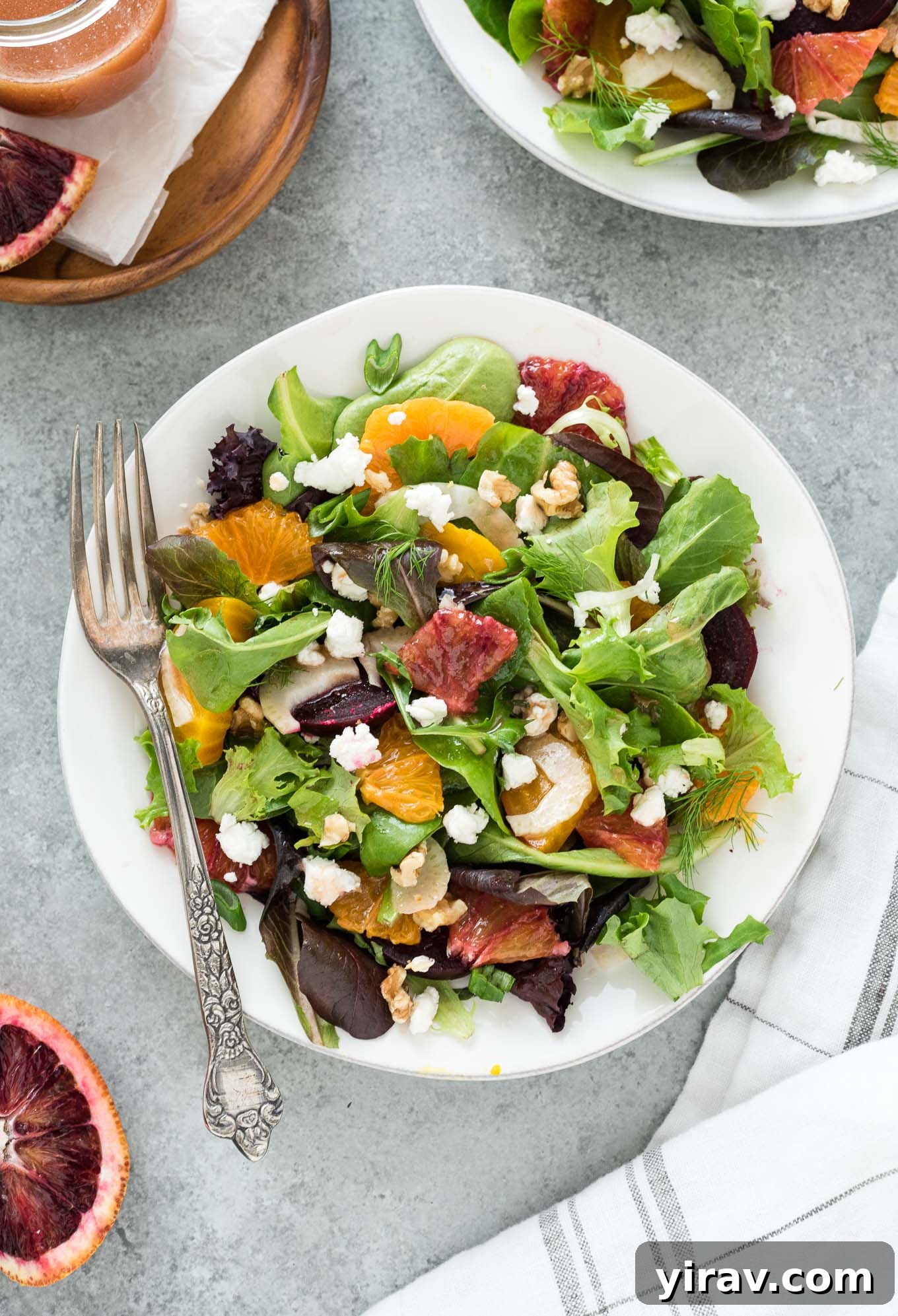 Roasted beet salad on a plate with a fork