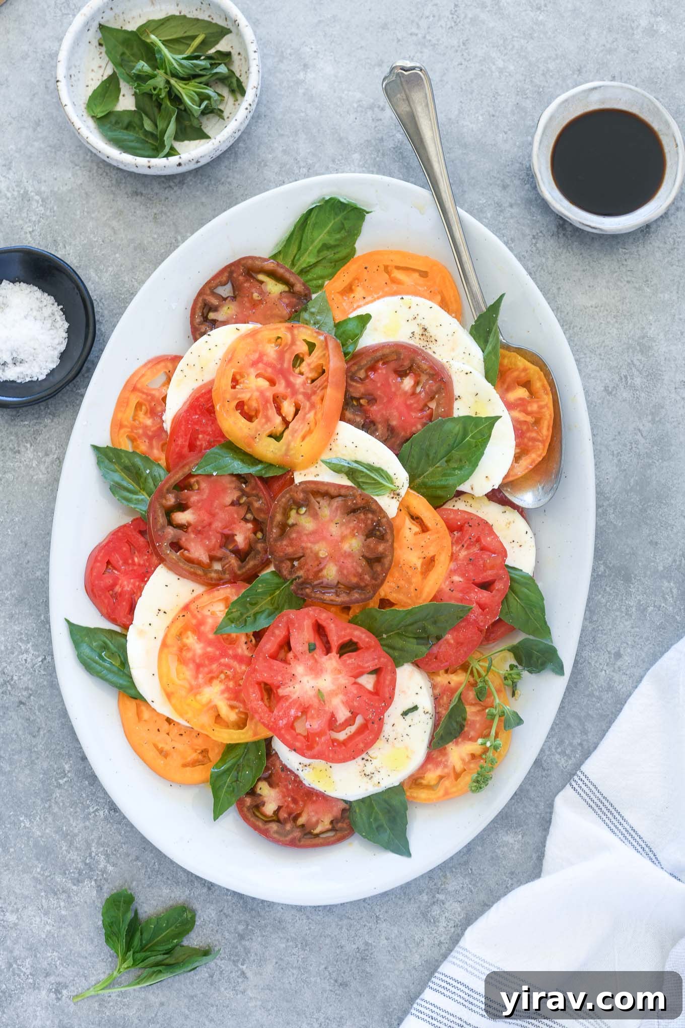 Caprese salad on a white platter