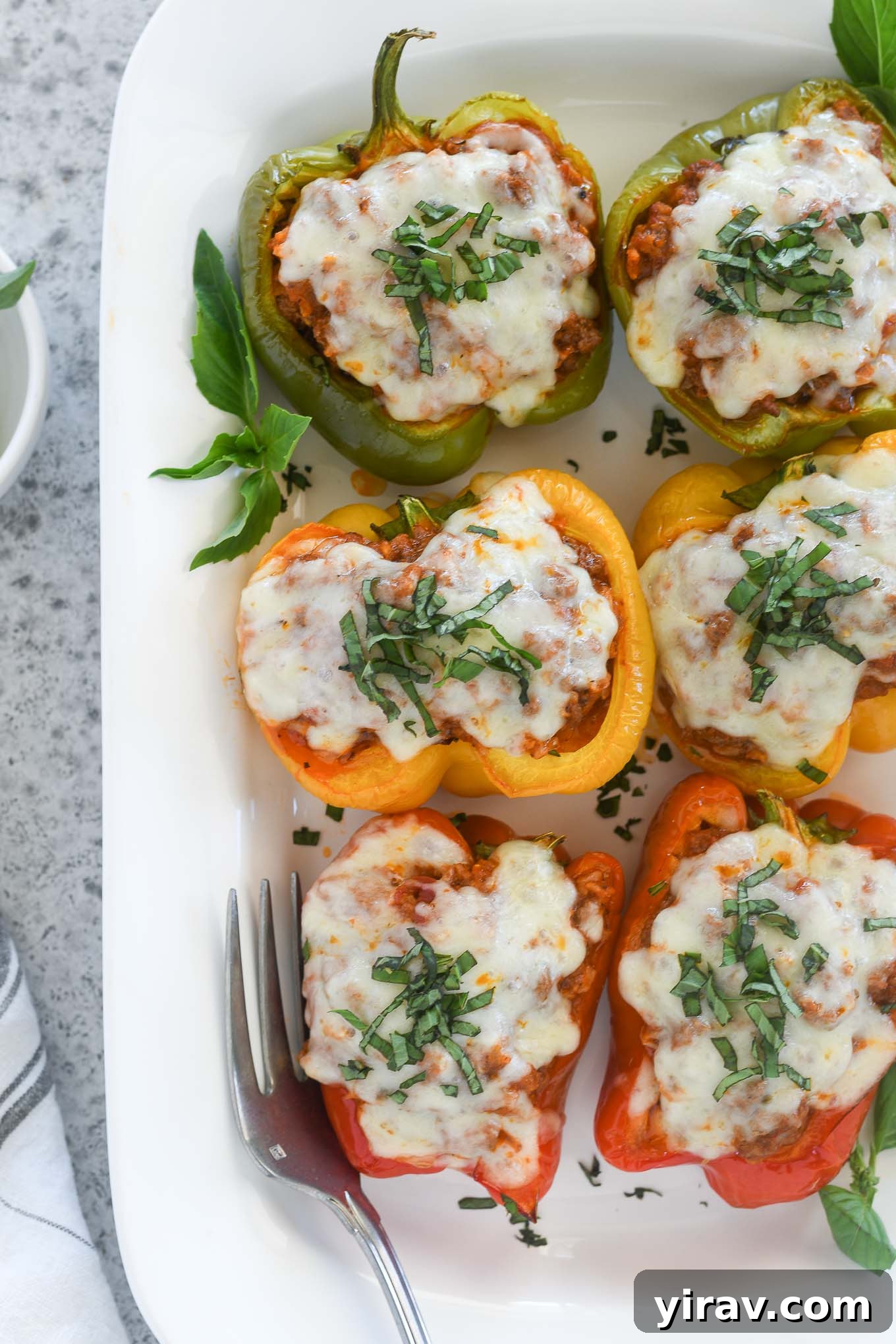 Italian stuffed peppers on a white serving platter