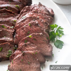 Santa Maria grilled tri tip roast sliced on a platter.