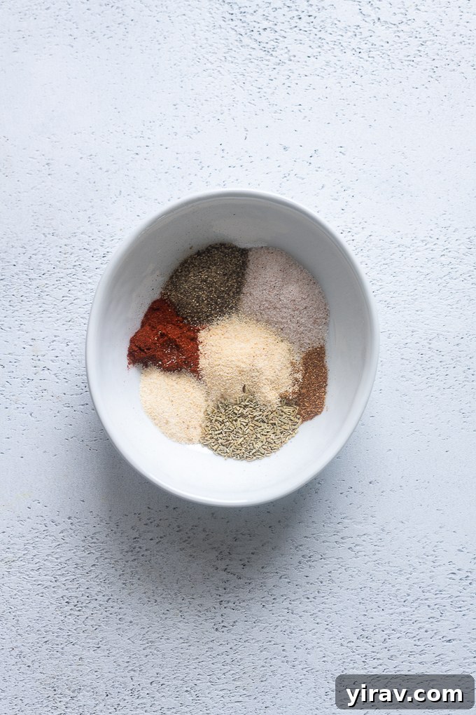 Combining ingredients for Santa Maria style rub for grilled tri tip in a small bowl.