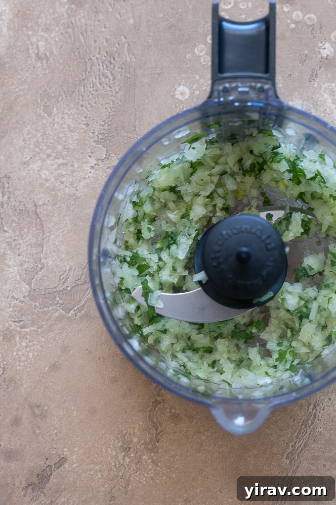 Finely chopped cilantro, onion, and garlic ready for mixing into the lamb kofta.