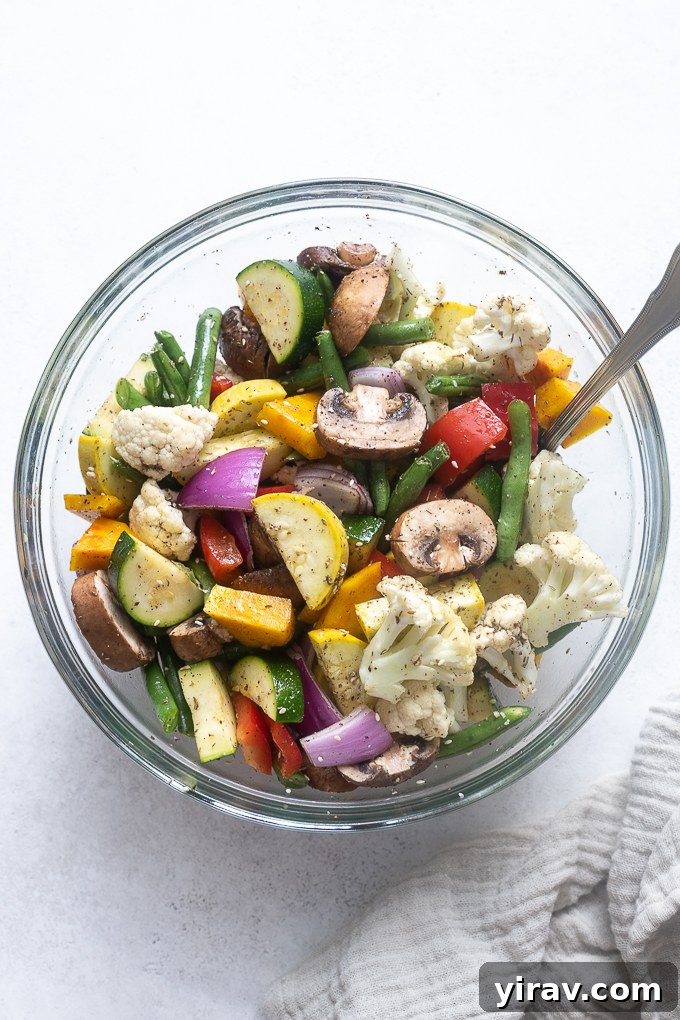 Vegetables coated with olive oil and za'atar spice, ready for the air fryer.
