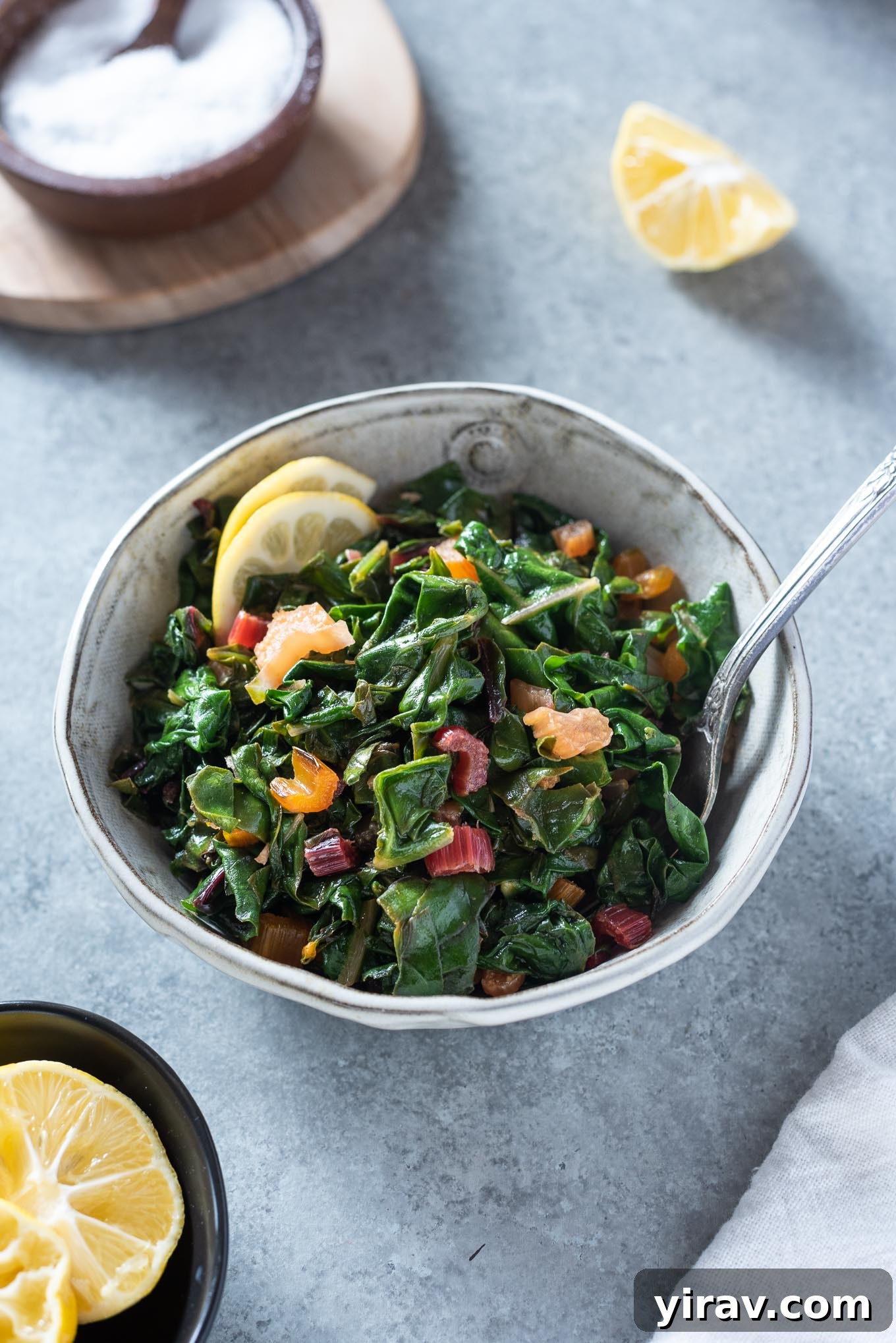 Bowl of sautéed swiss chard with lemon