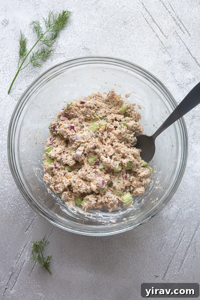 Prepared salmon salad in a mixing bowl.