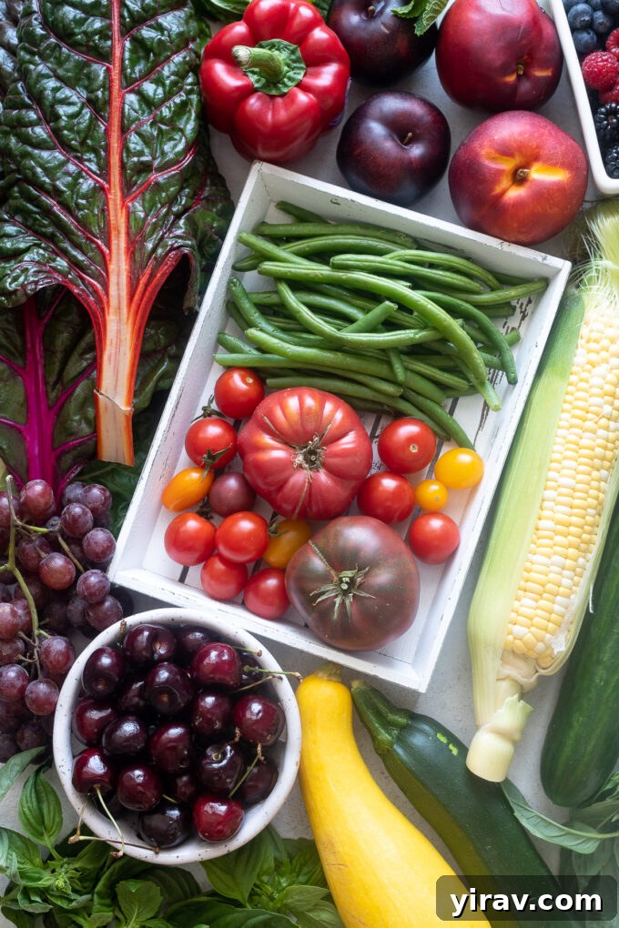A colorful array of seasonal vegetables and fruits typically found in August, showcasing the freshness of summer harvest.