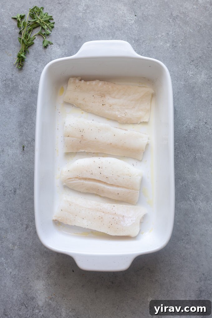 Place cod fish in baking dish and season.