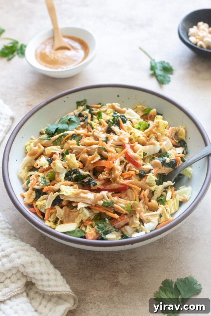 Thai chicken salad with peanut dressing in a bowl.
