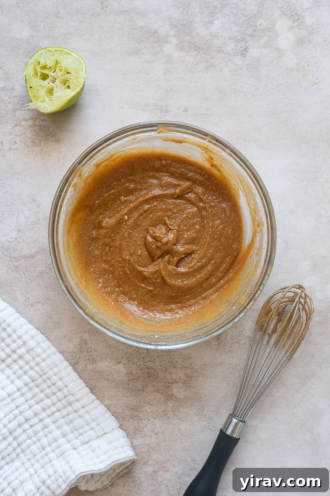 Peanut salad dressing combined in a mixing bowl.