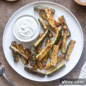Crispy Air Fried Zucchini Sticks 11 Air fryer zucchini fries on a plate with Greek yogurt ranch dip.