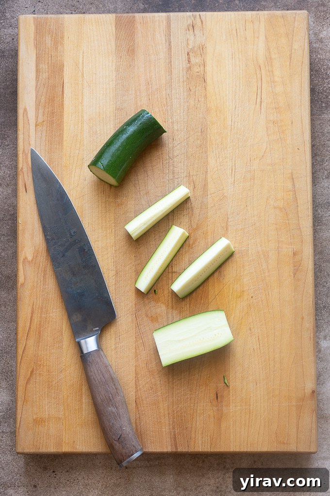 Crispy Air Fried Zucchini Sticks 5 Zucchini cut into french fry shapes.