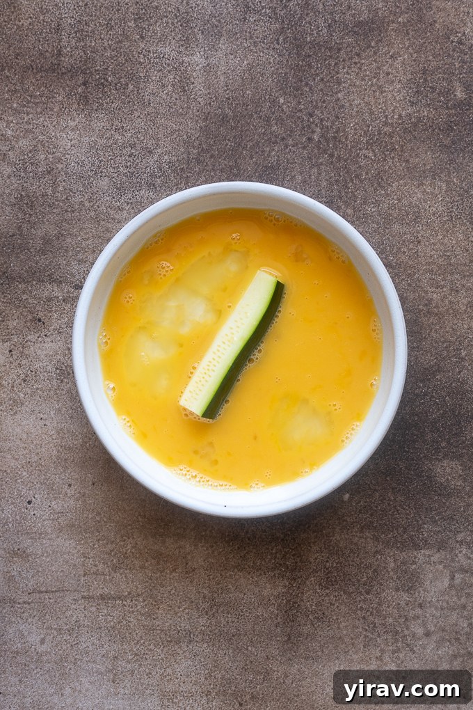 Crispy Air Fried Zucchini Sticks 6 Zucchini fries dipped in egg.