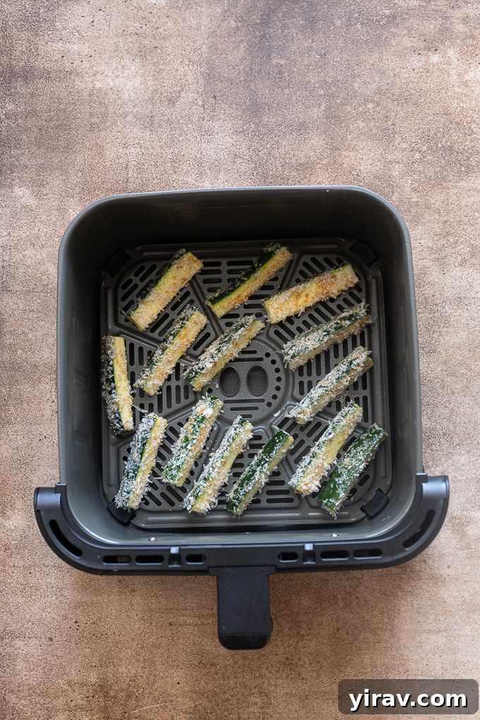 Crispy Air Fried Zucchini Sticks 8 Cooked zucchini fries in the air fryer.