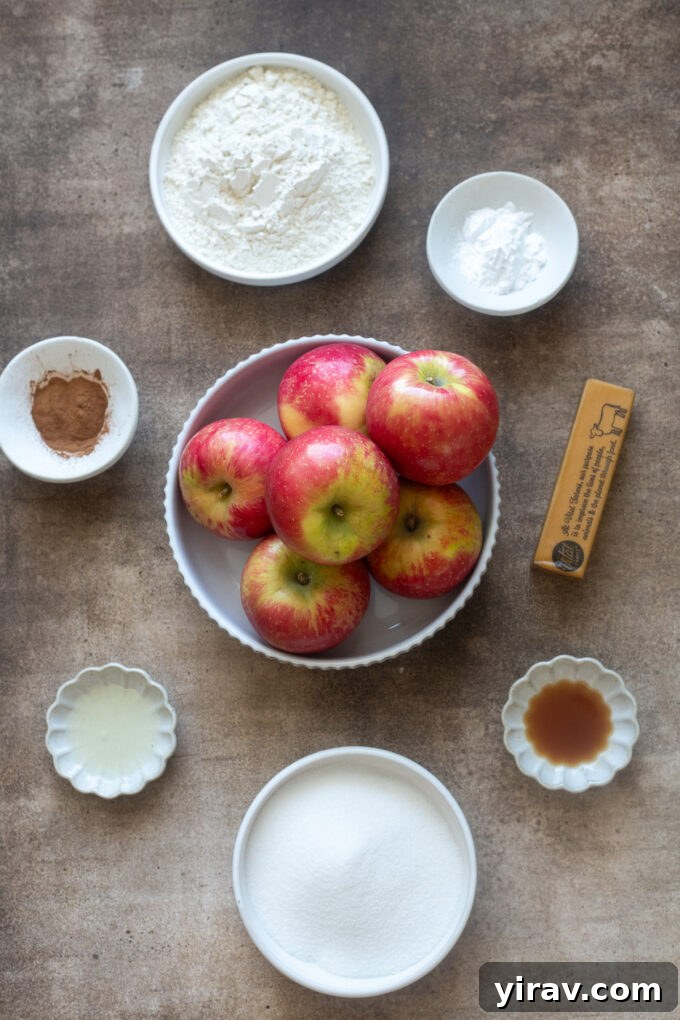 Golden Crumb Apple Pie Bars 4 Various ingredients for apple pie bars, including apples, flour, butter, and spices.