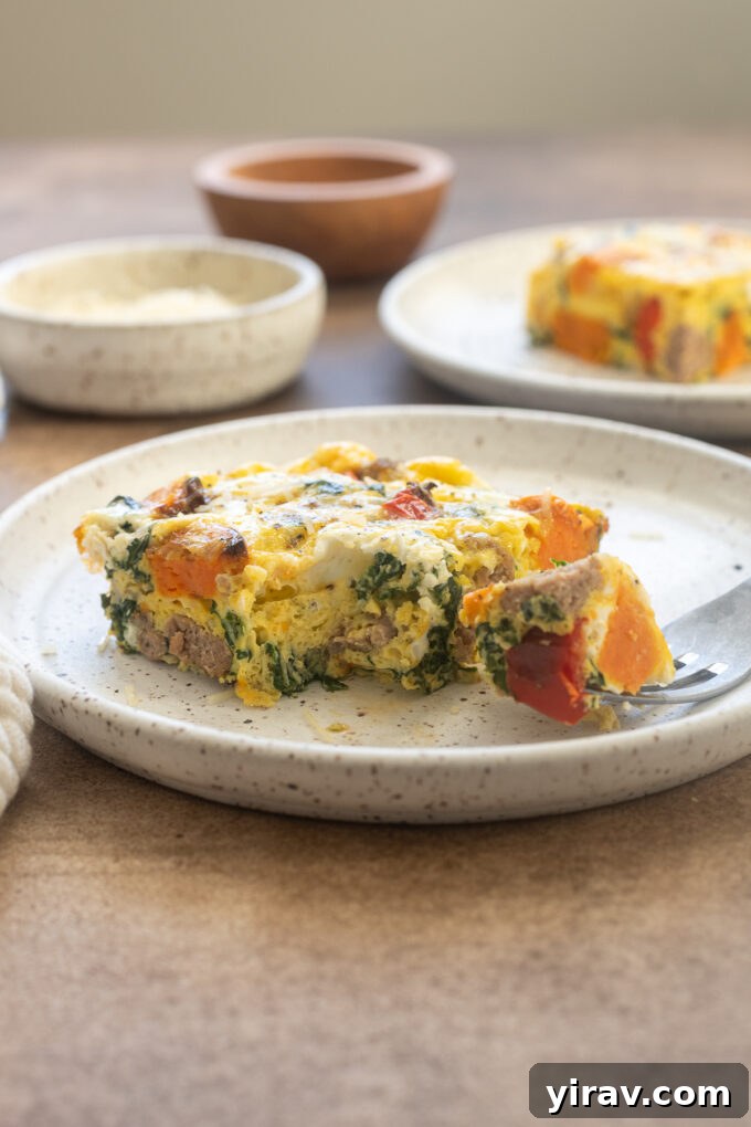 Slice of Sweet potato and sausage egg bake on a plate.