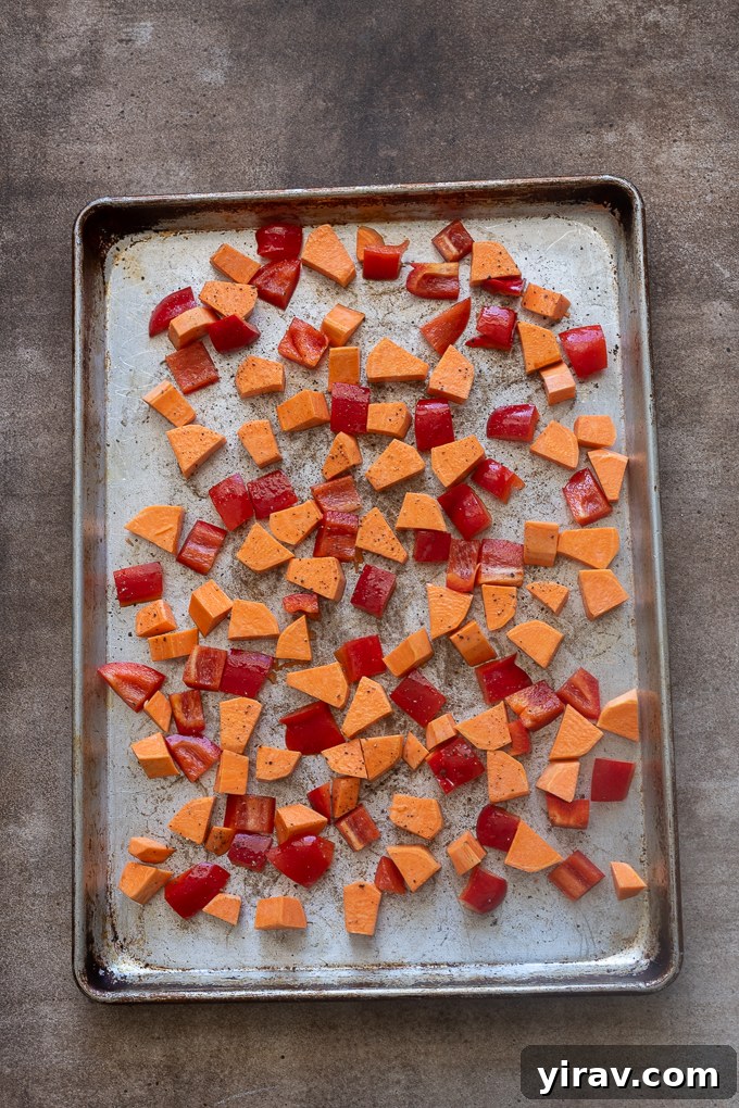 Sweet potato and red bell pepper before roasting for breakfast casserole.
