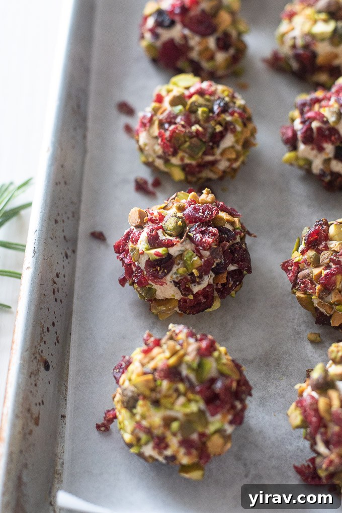 Mini goat cheese balls beautifully arranged on a baking sheet, ready for chilling