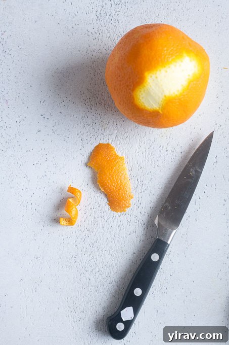 Cut off a thin slice of peel from top to bottom of the orange.
