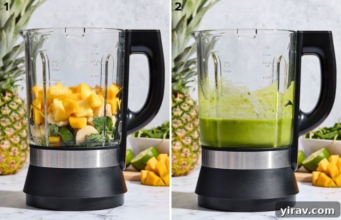 Tropical Green Power Smoothie 5 A top-down view of a blender filled with fresh kale, mango, pineapple, banana, and almond milk, ready to be blended for a healthy fruit smoothie.