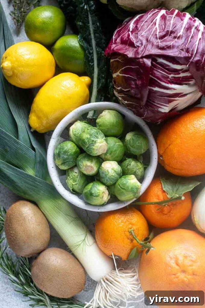January in season produce, featuring a medley of greens, squashes, and citrus.