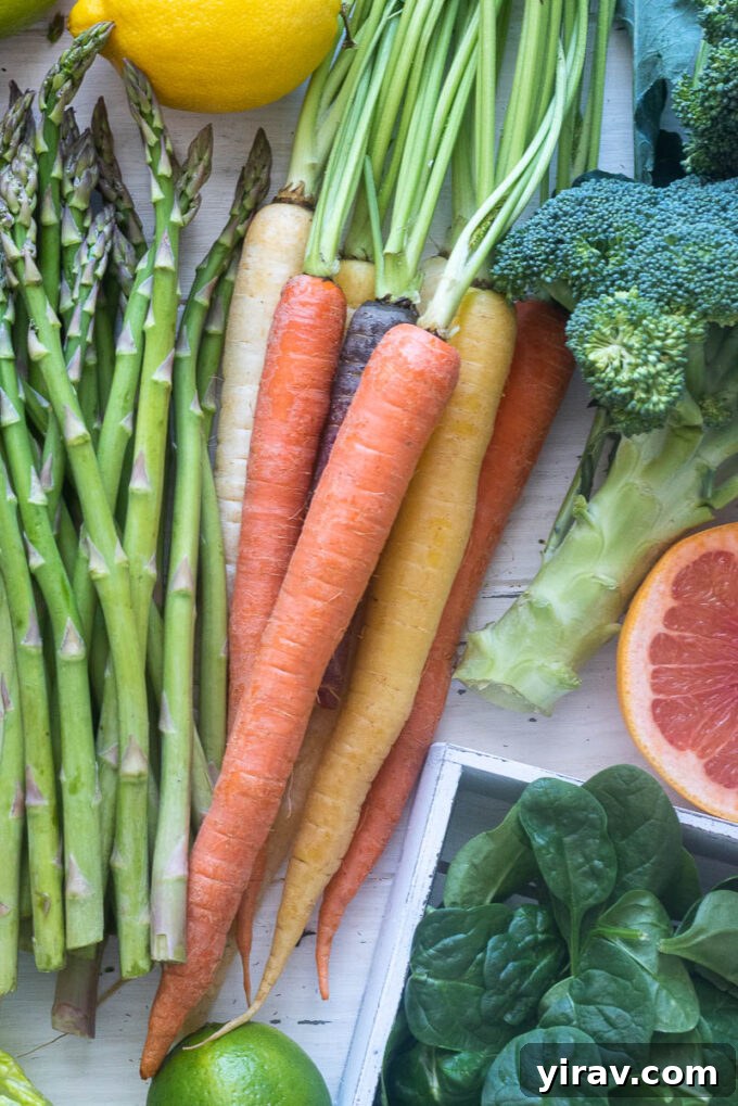 A pile of vibrant rainbow carrots, illustrating the selection and storage of root vegetables.