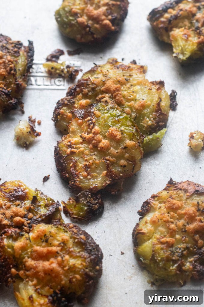 Crispy smashed brussels sprouts on baking sheet.