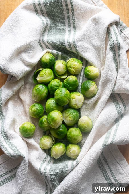 Dry the boiled brussels sprouts in a towel.