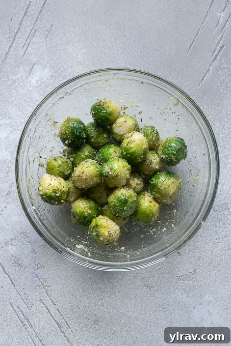 Season the boiled brussels sprouts.