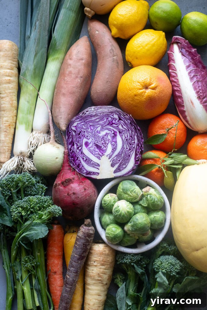 A vibrant display of fresh fruits and vegetables in season during February, including citrus, root vegetables, and leafy greens.