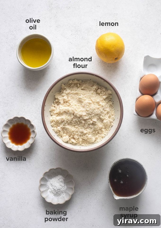 A display of all the essential ingredients laid out for preparing the almond flour lemon loaf cake recipe.