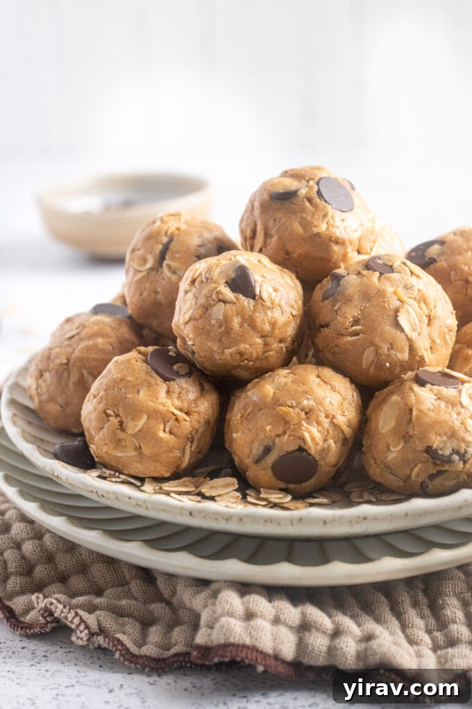 Delicious, easy-to-make peanut butter protein balls stacked on a white plate, ready for a healthy snack.