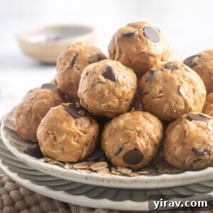 Peanut Butter Protein Balls piled on a plate, ready to eat.