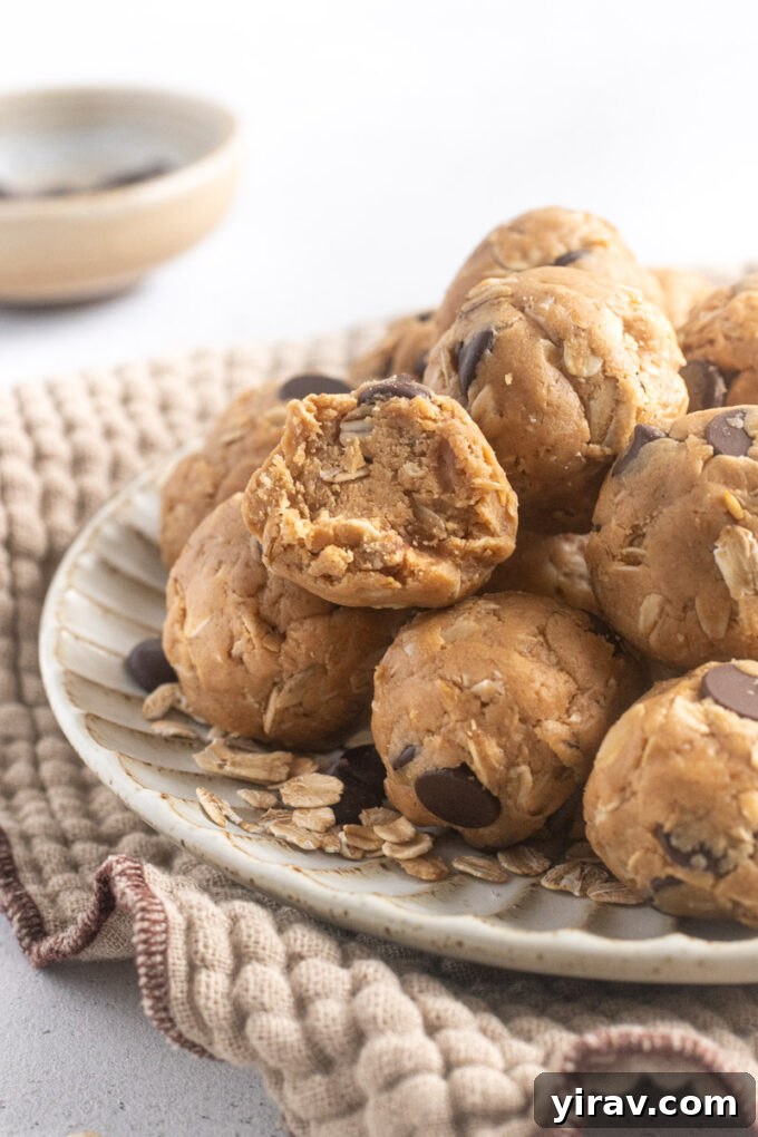 Close-up of a peanut butter protein ball with a bite taken out, showcasing its soft, chewy texture.