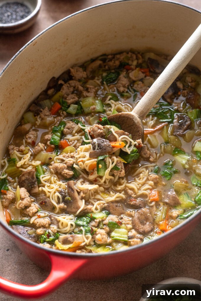 Ground pork ramen with bok choy in Dutch oven.