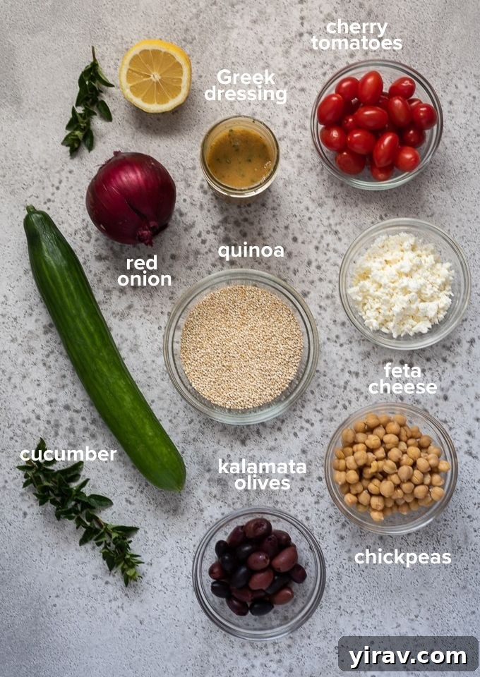 Various fresh ingredients laid out on a wooden board, including uncooked quinoa, cherry tomatoes, cucumbers, feta cheese, chickpeas, kalamata olives, and red onion, ready for making Greek quinoa salad.