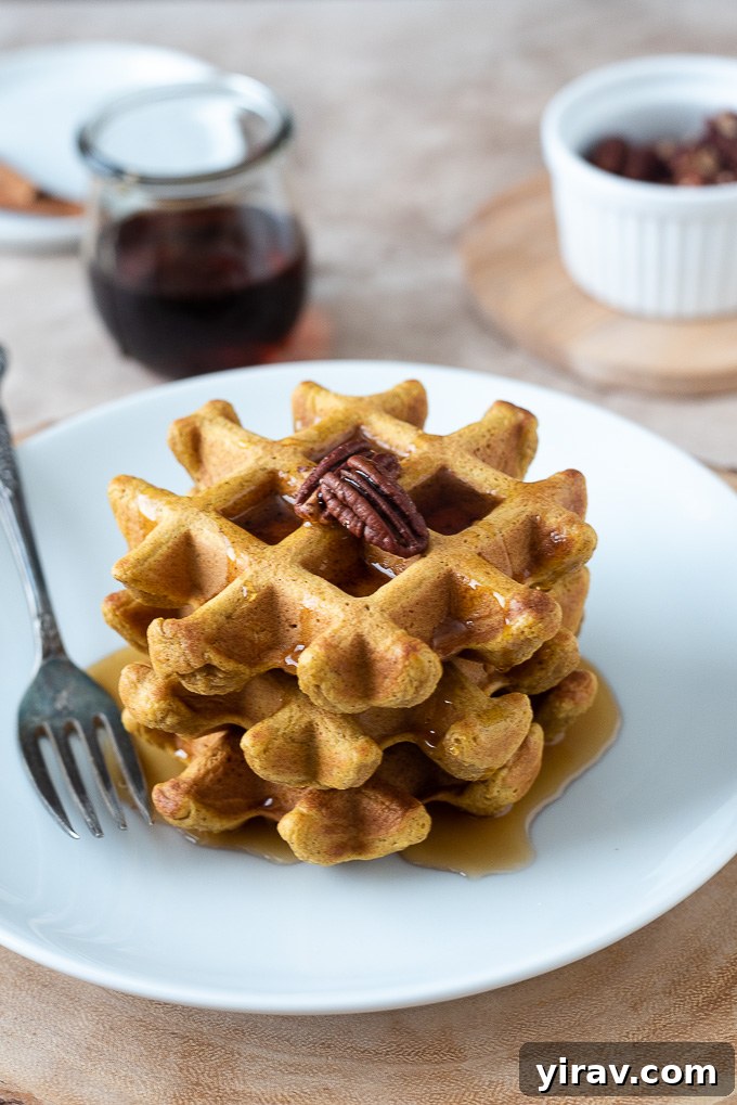 Wholesome Sweet Potato Waffles 3 Stack of sweet potato waffles topped with toasted pecans and maple syrup, a perfect healthy gluten-free breakfast