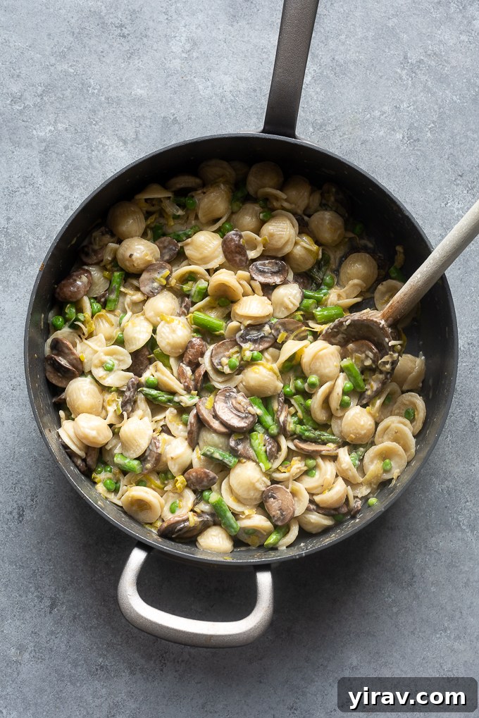 Effortless Spring Garden Pasta 8 Finished dish with the cooked vegetables, lemon and basil.