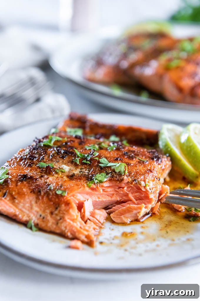 Blackened salmon on a plate with a bite taken out