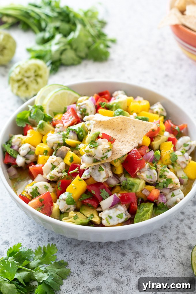 Effortless Shrimp Ceviche 7 Close-up of shrimp ceviche in a bowl, with a single chip dipped in