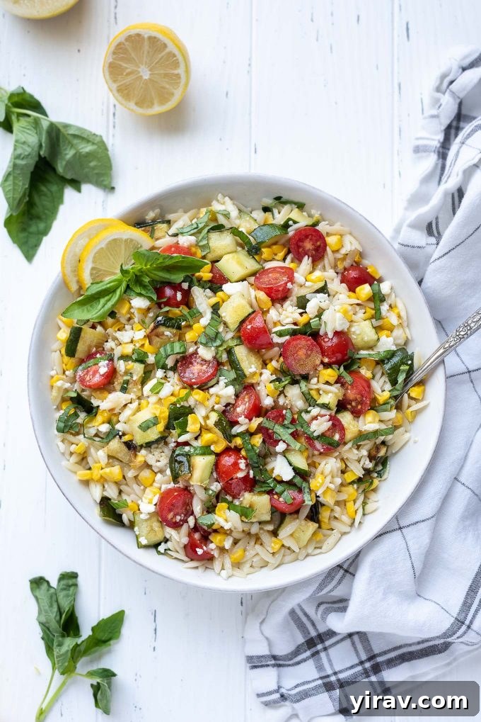 Bright Lemon Orzo Salad 2 Lemon orzo pasta salad in a white bowl with basil on top
