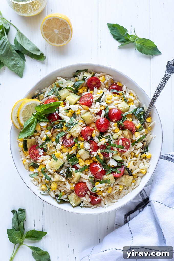 Bright Lemon Orzo Salad 6 Orzo pasta salad in a bowl with corn, cherry tomatoes and basil