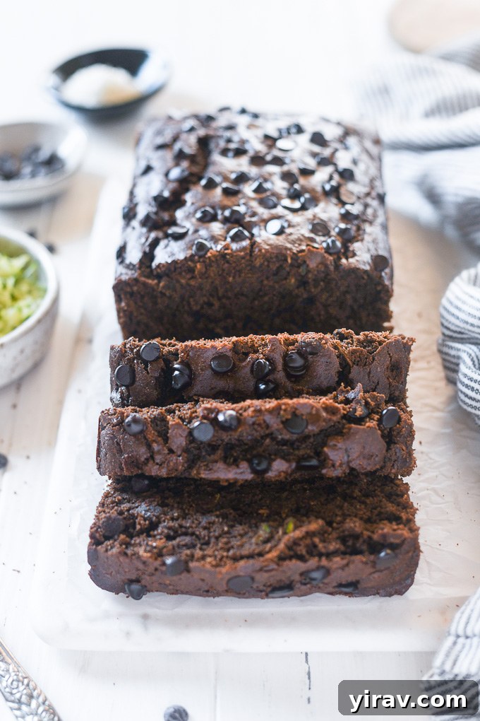 Decadent Double Chocolate Zucchini Loaf 7 Close-up of perfectly cut slices of chocolate zucchini bread, ready to be enjoyed.