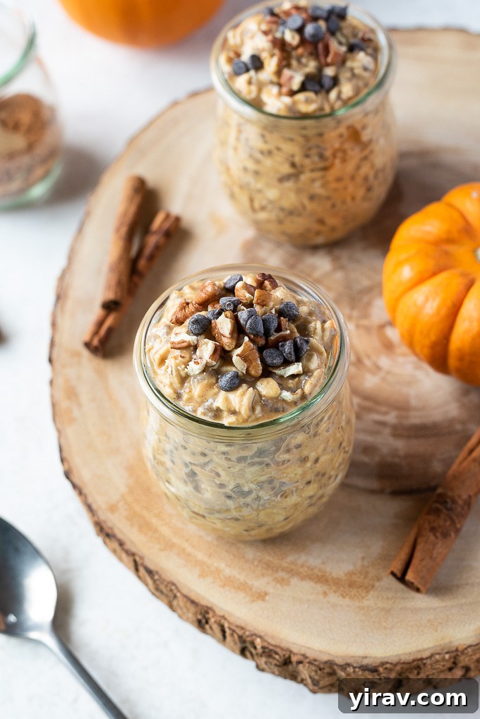 Pumpkin pie overnight oats in a jar with chocolate chips and pecans on top