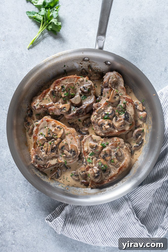Mushroom pork chops in a skillet