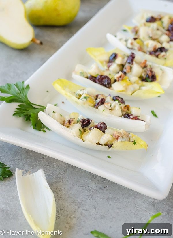 Endive Salad Bites on a platter, showcasing a vibrant and appealing appetizer arrangement.