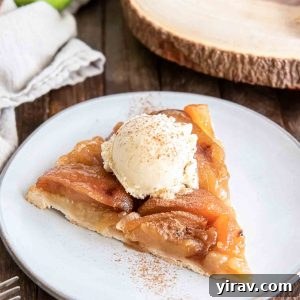 Signature Apple Tarte Tatin 8 Slice of apple tarte tatin on a plate with ice cream